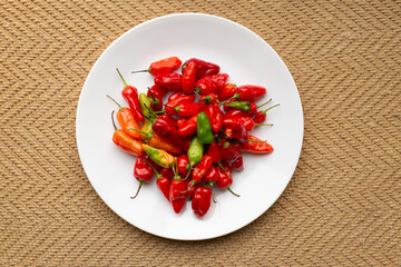 red sweet peppers on a white plate