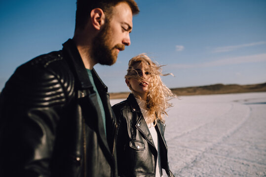 young blonde girl in love sensually look on boy
