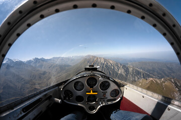 Gliders gliding over mountain range