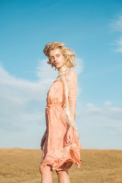 Female Fashion Model Wearing Silk Dress Outdoors