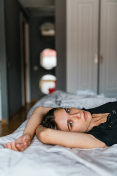 Beautiful woman lying down on bed