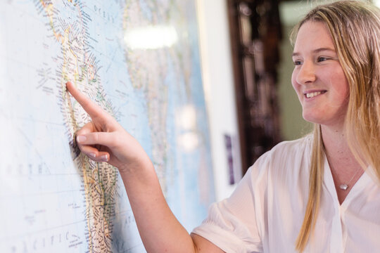 young woman looking at map