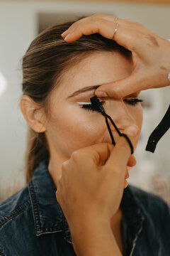 A woman in her twenties having her makeup professionally done