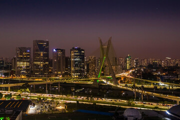 Fototapeta na wymiar The Octavio Frias de Oliveira bridge or Estaiada Bridge, a cable-stayed suspension bridge built over the Pinheiros River in the city of São Paulo, Brazil.
