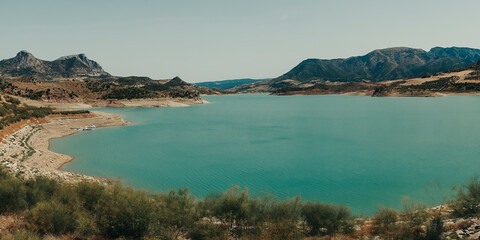 Panoramic of blue lake with nature and mountains.