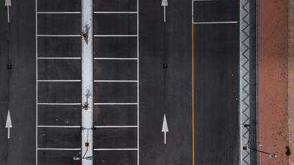 drone shot of a road marking - arrows and grid
