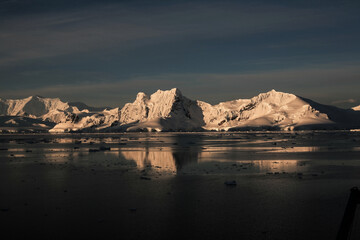 Sunset at Paradise Bay icebergs, Antarctic Peninsula.
