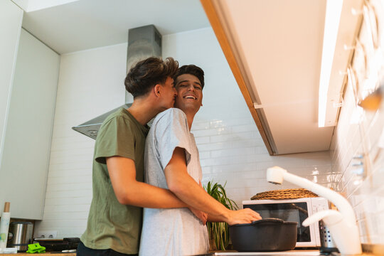 Gay couple cooking