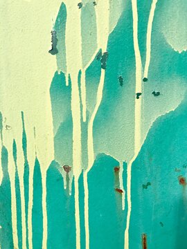 Close up of dripping graffiti paint on metal surface