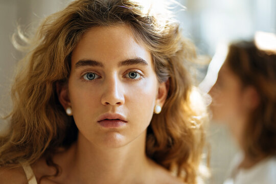 portrait of two beautiful girls with curly hair