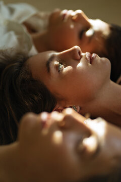 side view of three faces of teenagers