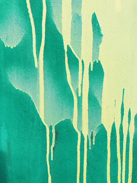 Close up of dripping graffiti paint on metal surface