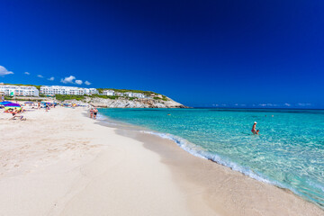 CALA MESQUIDA, MALLORCA, SPAIN - 19 July 2020: People enjoying beautiful sandy beach of on Mallorca, Mediterranean Sea, Spain.