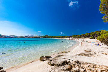 CALA AGULLA, MALLORCA, SPAIN - 21 July 2020: People enjoying summer on the popular beach on Mallorca,  Balearic Islands.