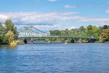 Havel River with recreational boats and Glienicke Bridge in Potsdam, Germany