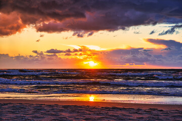 Fototapeta na wymiar Sunset view over the sea. Beautiful sunset over the sea. View of the beach, sea and sunset.
