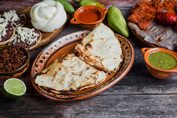 Tlayudas in half is a traditional Mexican food from Oaxaca Mexico