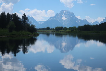 Fototapeta na wymiar Reflective lake water in Tetons National Park in Wyoming