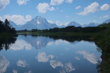 Reflective lake water in Tetons National Park in Wyoming