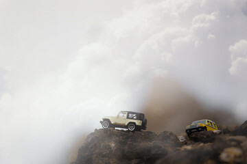 Plakat Group of 4wd off road cars on the top of montain.Travel and racing concept for four wheel drive and off road vehicle .