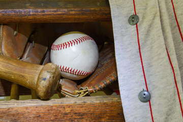 Vintage baseball, closeup, with bat, glove and jersey. 