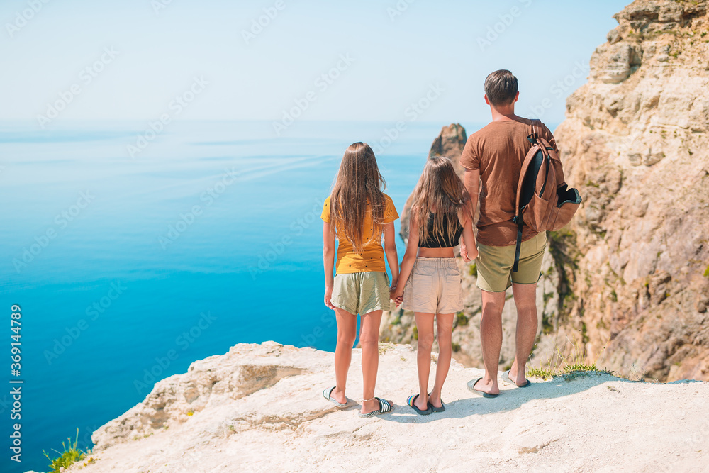 Wall mural happy beautiful family on a tropical beach vacation