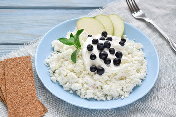 Healthy Breakfast of cottage cheese and blueberries on a napkin