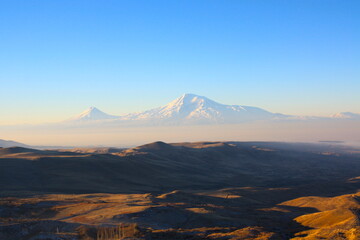 Colorful Ararat mountain in Armenia from Khor Virap monastery in Armenia, Turkey border, powerful blue sky.