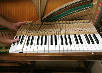 piano tuning, repairing and cleaning the vintage piano