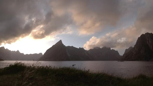 Timelapse of sunset and dramatic clouds over the fjords in Lofoten, Norway