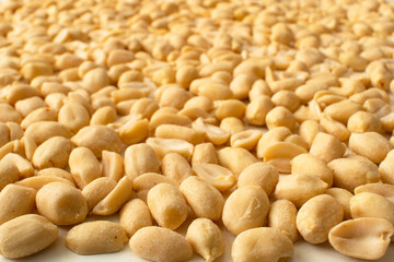 Close up of Raw Peanuts on a White Table