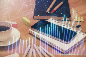 Double exposure of forex chart drawing and cell phone background. Concept of financial trading