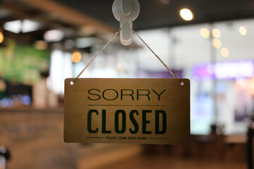Shop closed of storefront sign.