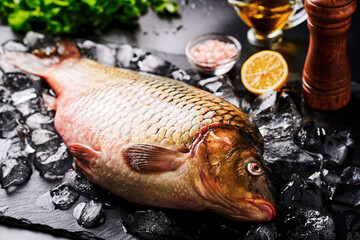Beautiful, fresh, raw fish (carp) lies on the ice.