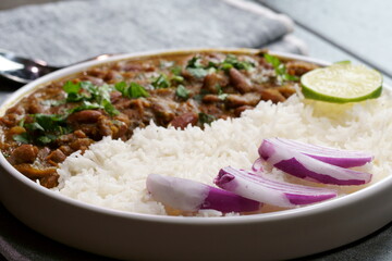 A platter of Indian red Kidney beans curry or Rajma Masala and rice