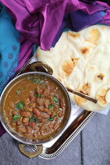 A platter of Indian red Kidney beans curry or Rajma Masala and rice