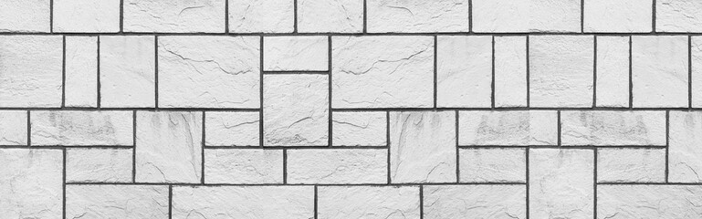 Panorama of Block pattern of white stone cladding wall tile texture and seamless background