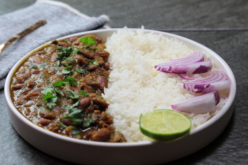 A platter of Indian red Kidney beans curry or Rajma Masala and rice