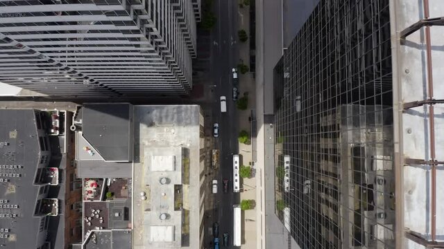 Aerial Scaling Down Skyscraper Lowering Towards Street