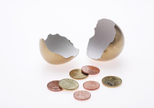 EGG AND COINS, SYMBOLIC IMAGE