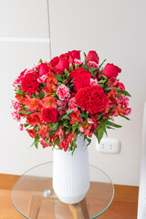 Flower arrangement of red roses in a nice living room