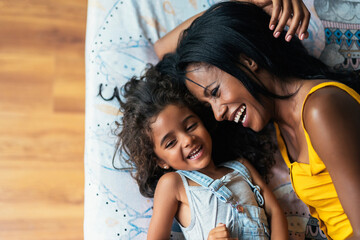 Mother and daughter playing at home