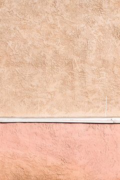 A textured orange and pink wall