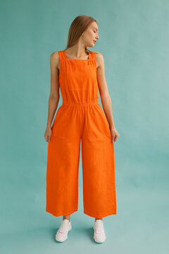 Trendy female in orange jumpsuit