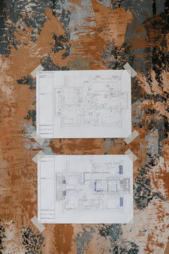 Two detailed maps of building on wall background.