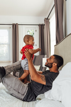 Dad Bounces Baby