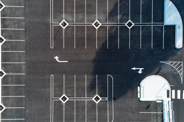 Aerial view of freshly marked road way asphalt carpark