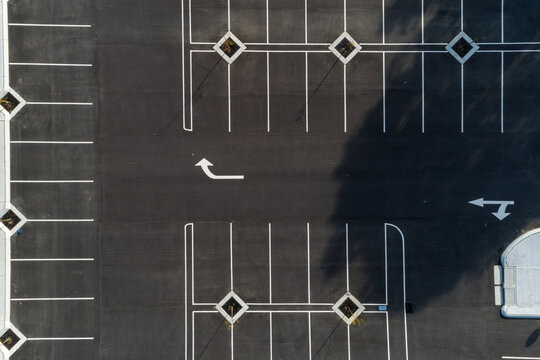 Aerial view of freshly marked road way asphalt carpark