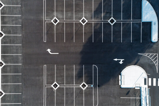 Aerial view of freshly marked road way asphalt carpark