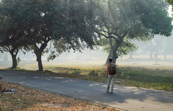 Woman with backpack in a pathway in Prambanan Temple, Java, Indonesia